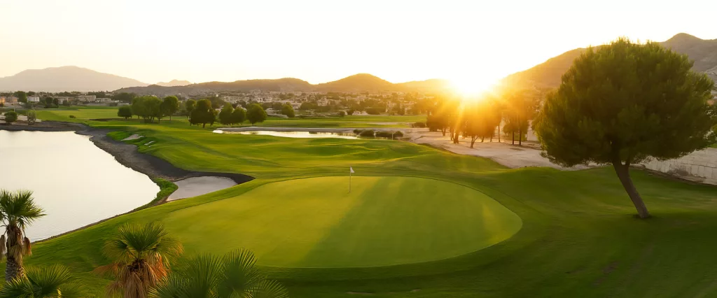 panoramic view of the golf course at Altaona Resort Murcia with Mediterranean sunrise.